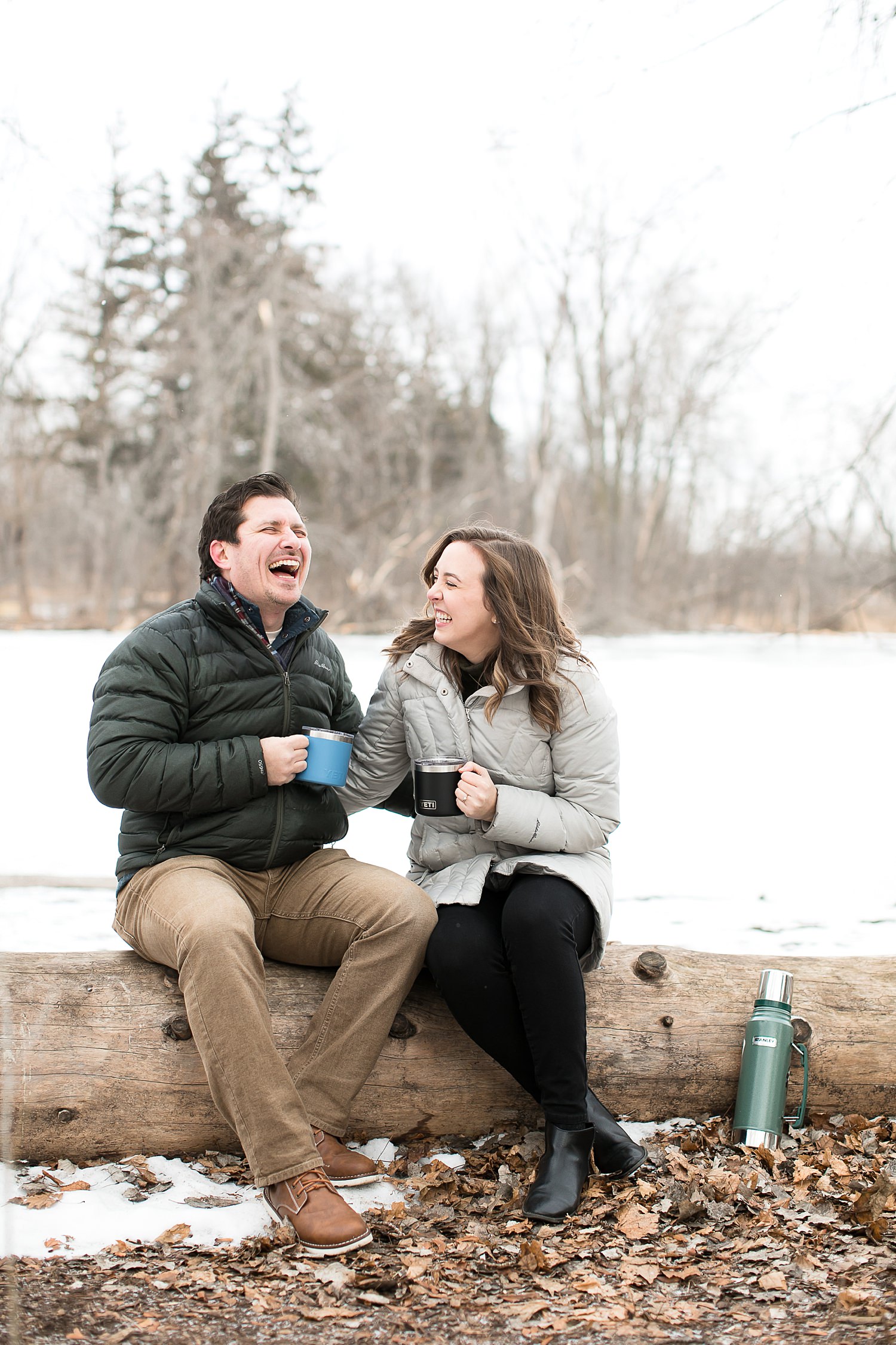 Couple drinks hot chocolate during their Chicago engagement photos